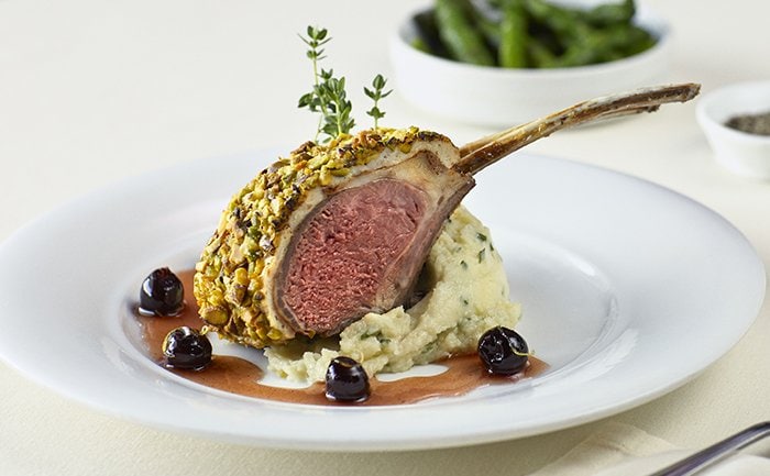 Pistachio-crusted lamb chop with mashed potatoes and cherry sauce | MSC Cruises Pistachio-crusted lamb chop with mashed potatoes and cherry sauce | MSC Cruises
