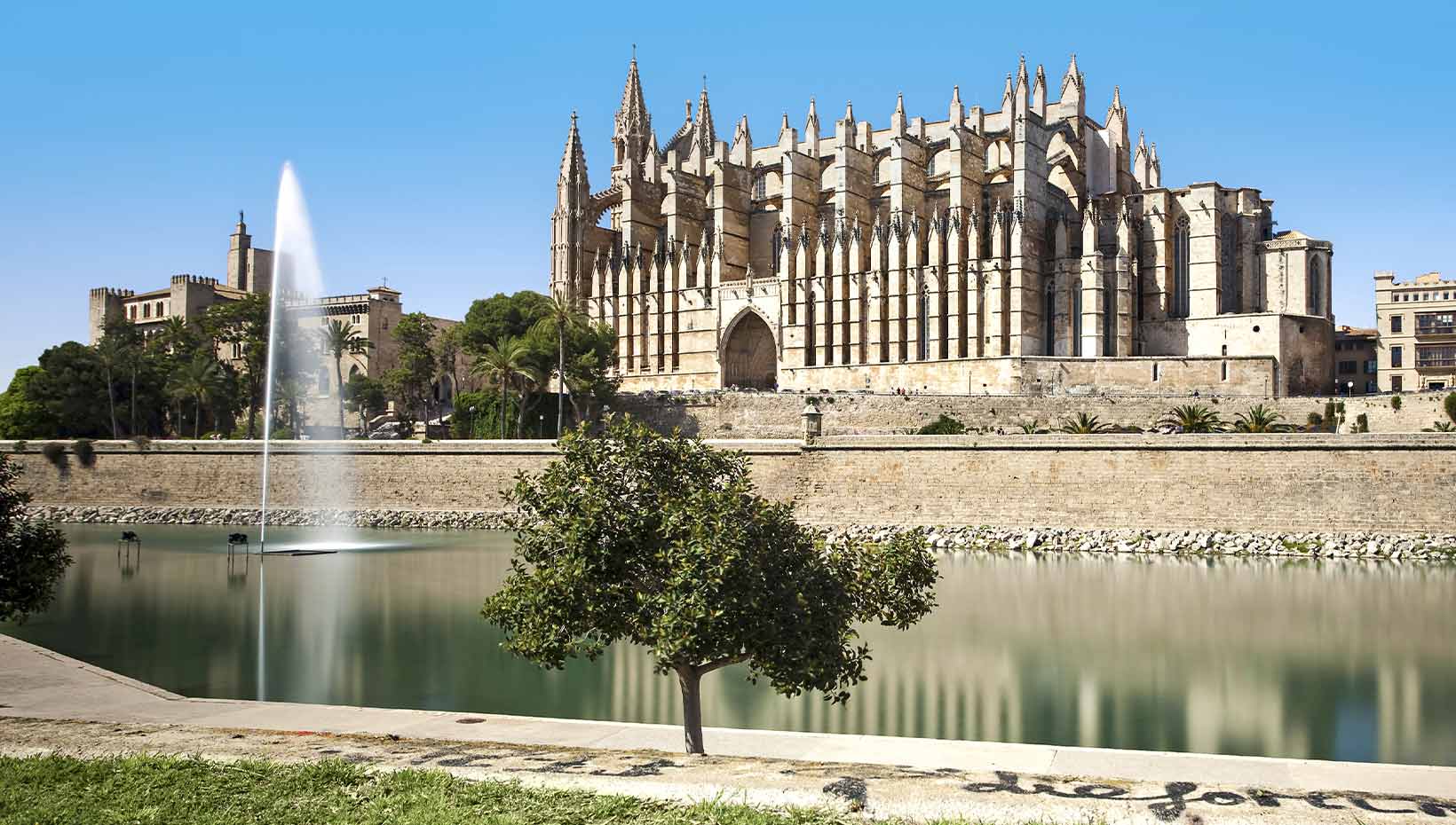 The iconic Palma Cathedral by a serene waterfront in Mallorca | MSC Cruises The iconic Palma Cathedral by a serene waterfront in Mallorca | MSC Cruises