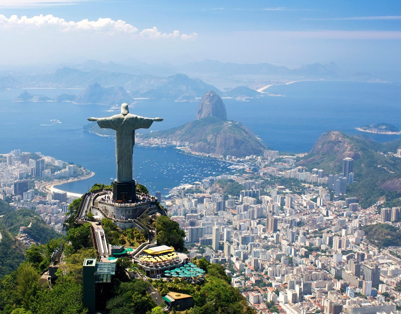 Christ the Redeemer overlooking Rio de Janeiro with Sugarloaf Mountain and Guanabara Bay in the background | MSC Cruises